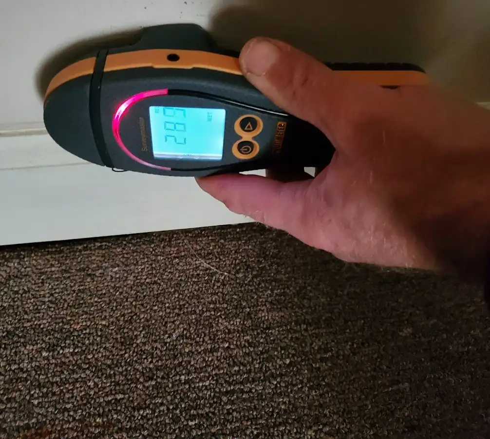 Moisture detection at baseboard during Burst Pipe Cleanup in Chadron